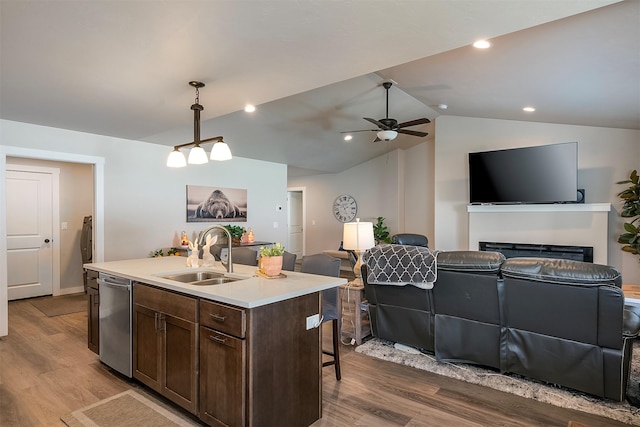 517 Raven Ln, Kalispell, MT 59901 - kitchen with open floor plan, dishwasher, dark brown cabinetry, wood finished floors, and pendant lighting