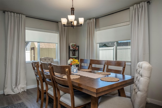 517 Raven Ln, Kalispell, MT 59901 - dining area featuring wood finished floors and a chandelier