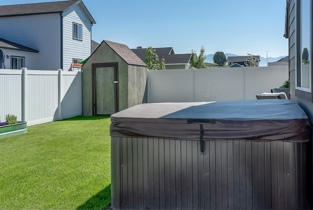 517 Raven Ln, Kalispell, MT 59901 - fenced backyard with a hot tub and a shed