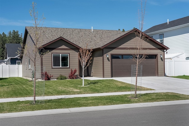 517 Raven Ln, Kalispell, MT 59901 - view of front of home with a garage, driveway, and roof with shingles
