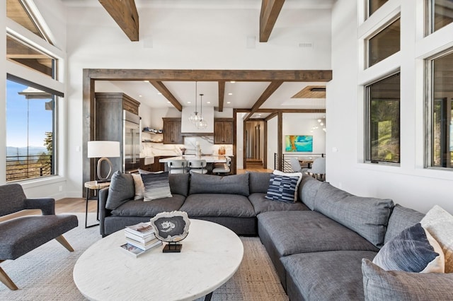 145 Elk Highlands Dr, Whitefish, MT 59937 - living area featuring beam ceiling and light wood-style flooring