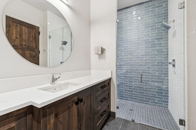 145 Elk Highlands Dr, Whitefish, MT 59937 - bathroom with a stall shower, vanity, and tile patterned floors