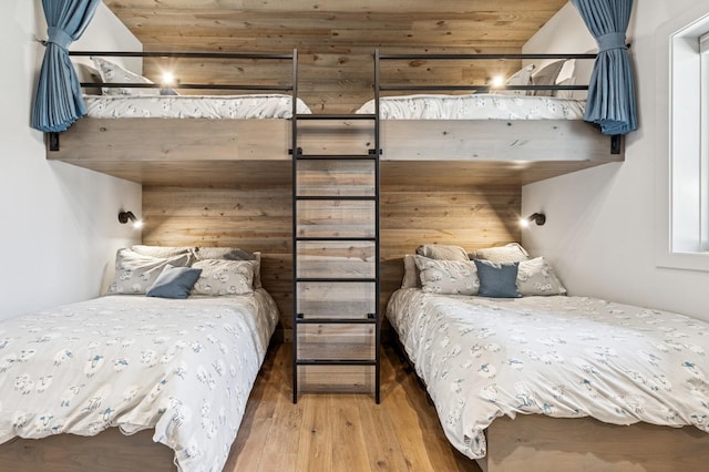 145 Elk Highlands Dr, Whitefish, MT 59937 - bedroom with wood finished floors and wood walls