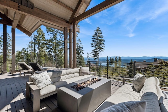 145 Elk Highlands Dr, Whitefish, MT 59937 - wooden terrace with an outdoor living space with a fire pit and a mountain view