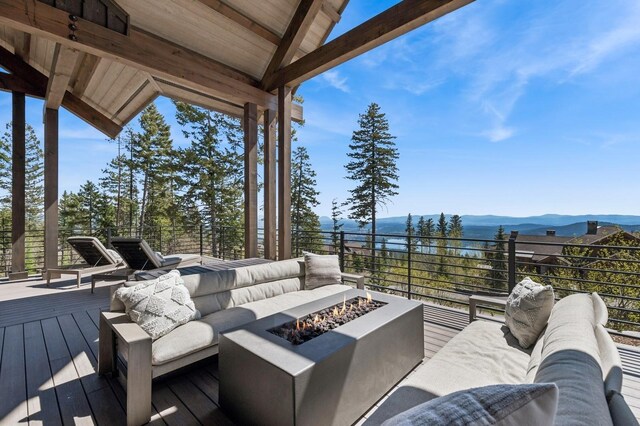 145 Elk Highlands Dr, Whitefish, MT 59937 - deck with an outdoor living space with a fire pit and a mountain view