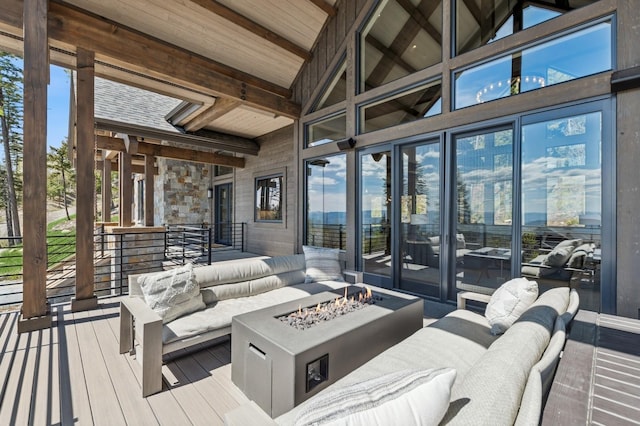 145 Elk Highlands Dr, Whitefish, MT 59937 - wooden terrace featuring an outdoor living space with a fire pit