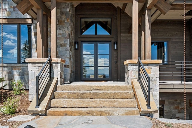 145 Elk Highlands Dr, Whitefish, MT 59937 - entrance to property featuring french doors and stone siding