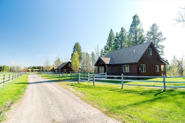 view of street with a barn