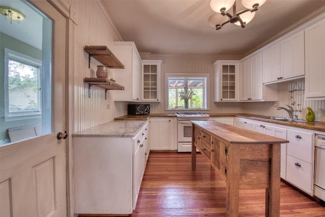 kitchen with white gas stove, a sink, open shelves, and dark wood-style floors