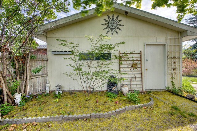 view of outdoor structure featuring fence