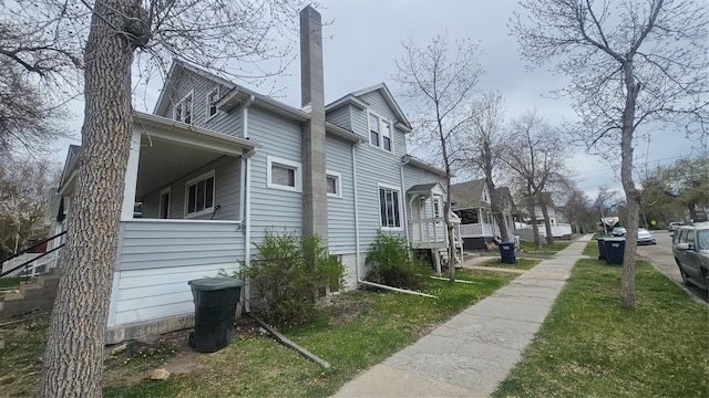 800 6th Ave N, Great Falls, MT 59401 - view of property exterior featuring a chimney, a yard, and a residential view