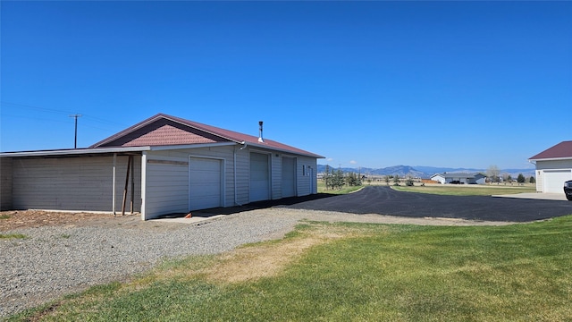 2315 Cattle Dr, East Helena, MT 59635 - garage featuring a mountain view