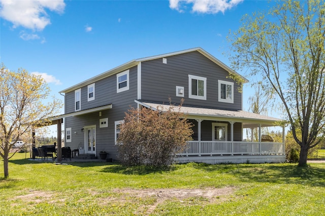 31 Aspen Ct, Kalispell, MT 59901 - rear view of property featuring a porch and a lawn