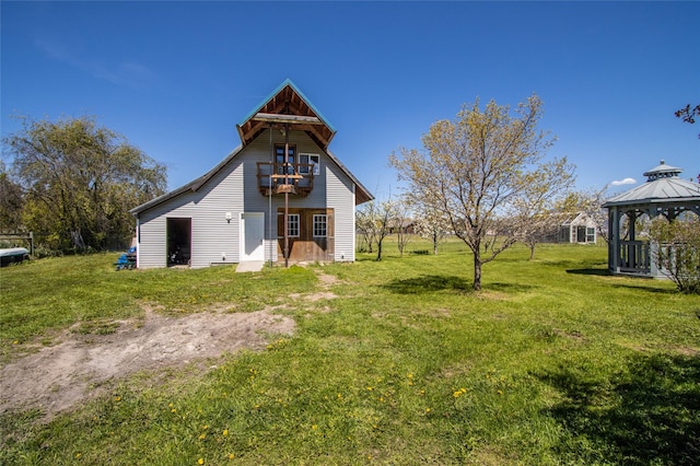 31 Aspen Ct, Kalispell, MT 59901 - back of house with a gazebo and a lawn