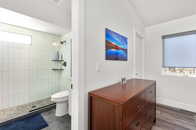 full bath with walk in shower, toilet, and baseboards