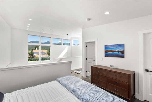 bedroom featuring wood finished floors and recessed lighting