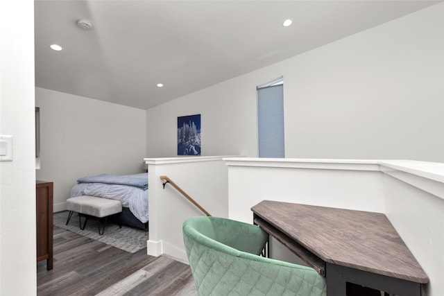 bedroom with wood finished floors, recessed lighting, and baseboards