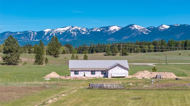 view of mountain backdrop featuring rural landscape