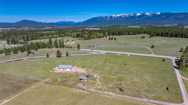 aerial view of sparsely populated area featuring a mountainous background