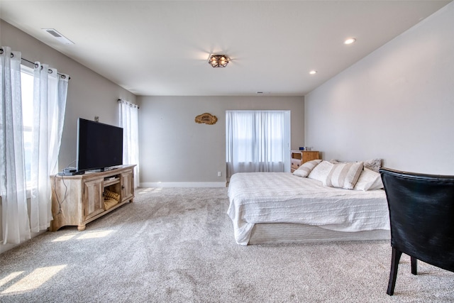 bedroom with multiple windows, carpet flooring, recessed lighting, and baseboards