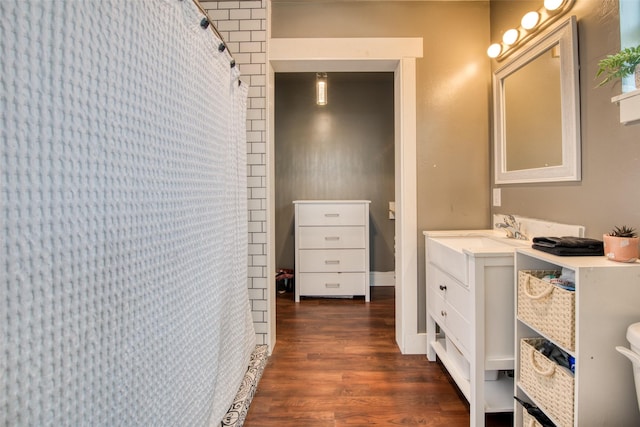 full bath with wood finished floors and vanity