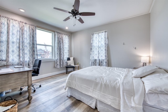 bedroom with light wood-type flooring, baseboards, a desk, recessed lighting, and ceiling fan