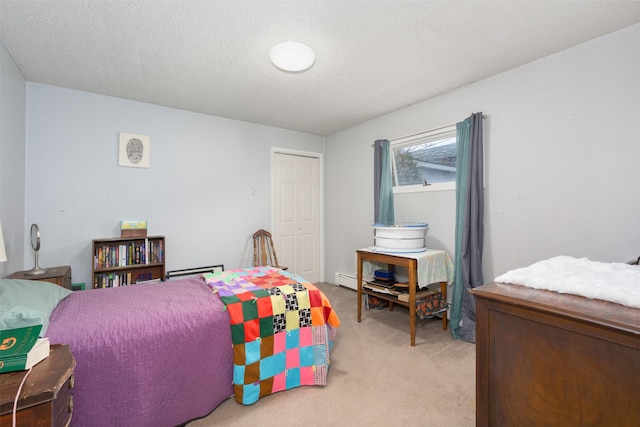 412 Spruce St, Anaconda, MT 59711 - bedroom with light carpet, a closet, and a textured ceiling
