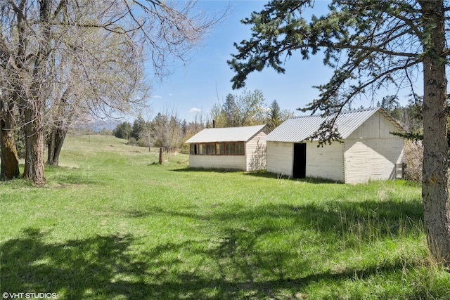 222 Lundeen Rd, Eureka, MT 59917 - view of grassy yard featuring an outbuilding