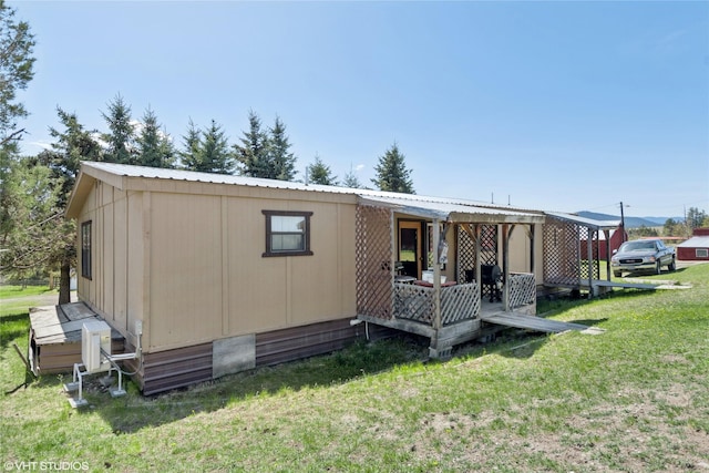 222 Lundeen Rd, Eureka, MT 59917 - back of property with a lawn and metal roof