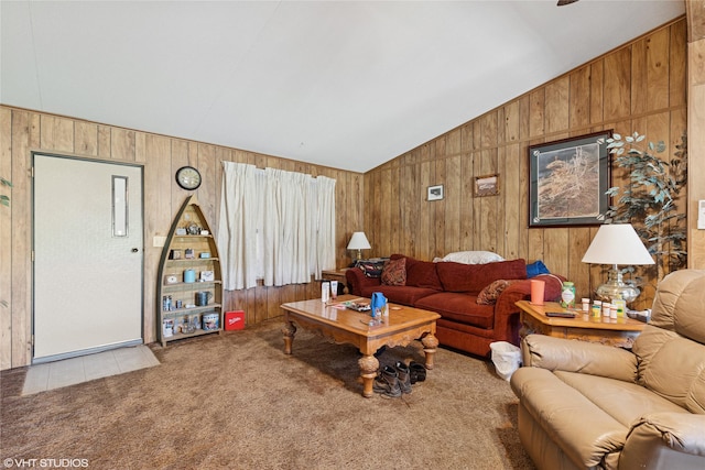 222 Lundeen Rd, Eureka, MT 59917 - carpeted living room featuring wood walls, vaulted ceiling, and a ceiling fan