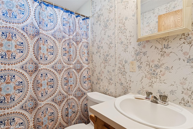 222 Lundeen Rd, Eureka, MT 59917 - full bathroom with toilet, wallpapered walls, vanity, and curtained shower
