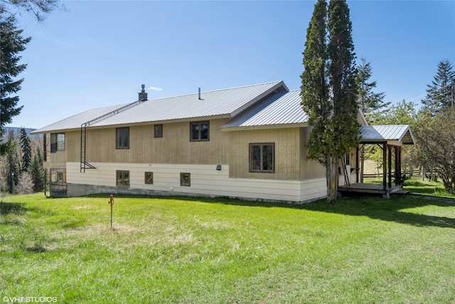 222 Lundeen Rd, Eureka, MT 59917 - back of house with a yard and metal roof