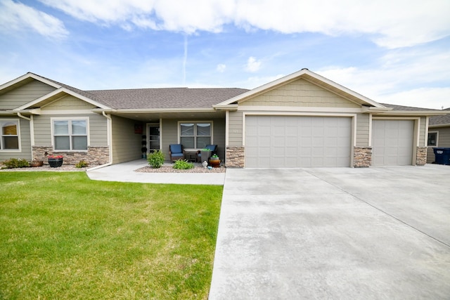 121 Choteau Ave NE, Great Falls, MT 59404 - view of front of home with a garage, stone siding, driveway, a front lawn, and roof with shingles