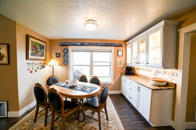 121 Choteau Ave NE, Great Falls, MT 59404 - dining space with baseboards, dark wood-type flooring, and a chandelier