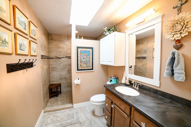 121 Choteau Ave NE, Great Falls, MT 59404 - bathroom featuring baseboards, walk in shower, toilet, and vanity