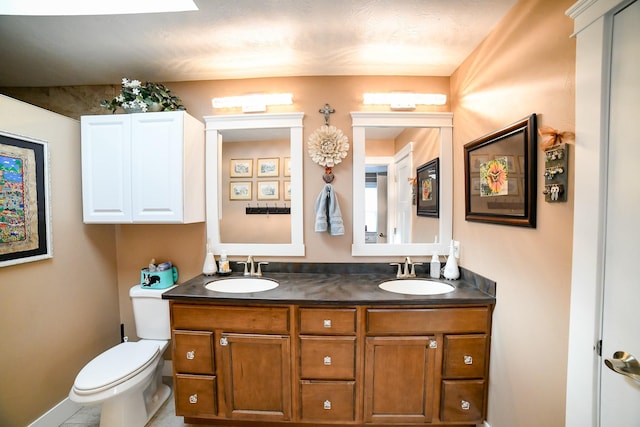 121 Choteau Ave NE, Great Falls, MT 59404 - full bathroom with double vanity, toilet, and baseboards