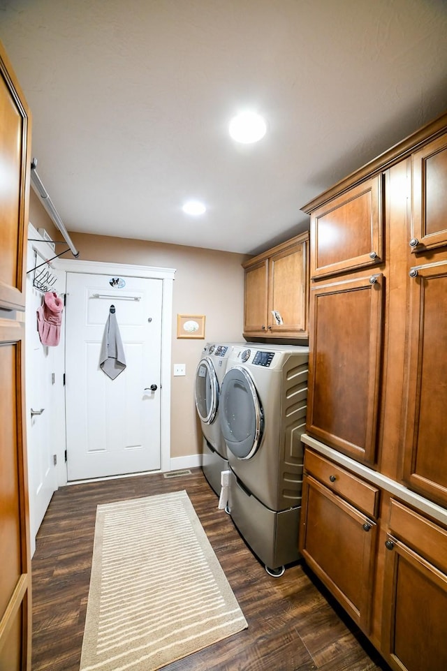121 Choteau Ave NE, Great Falls, MT 59404 - clothes washing area featuring washing machine and dryer, cabinet space, dark wood-style floors, recessed lighting, and baseboards