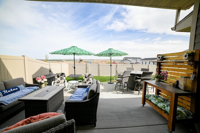 121 Choteau Ave NE, Great Falls, MT 59404 - deck featuring outdoor dining area, an outdoor living space, a fenced backyard, and a patio area