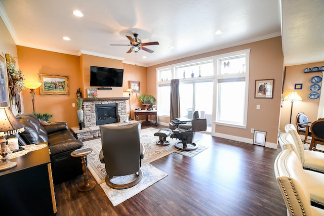 121 Choteau Ave NE, Great Falls, MT 59404 - living area with a ceiling fan, wood finished floors, a fireplace, baseboards, and ornamental molding