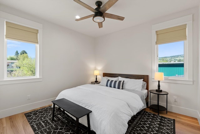 5519 Golf Dr, Lolo, MT 59847 - bedroom featuring baseboards, wood finished floors, and ceiling fan
