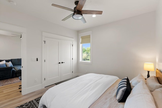 5519 Golf Dr, Lolo, MT 59847 - bedroom featuring light wood-style floors, baseboards, recessed lighting, a ceiling fan, and a closet
