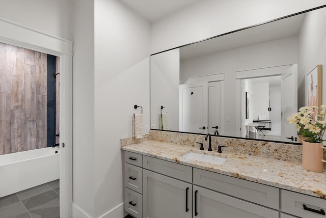 5519 Golf Dr, Lolo, MT 59847 - full bathroom with vanity, washtub / shower combination, and baseboards