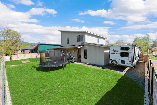 5519 Golf Dr, Lolo, MT 59847 - rear view of property featuring a trampoline