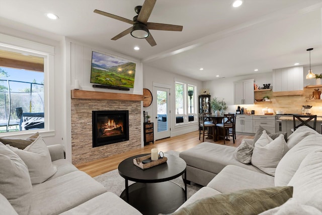 5519 Golf Dr, Lolo, MT 59847 - living room featuring light wood-style floors, ceiling fan, a fireplace, and recessed lighting