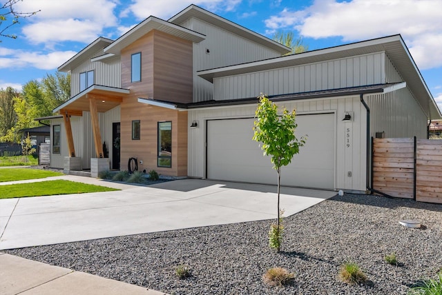 5519 Golf Dr, Lolo, MT 59847 - view of front of house with concrete driveway, an attached garage, and fence