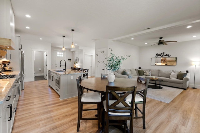 5519 Golf Dr, Lolo, MT 59847 - dining room with light wood-style flooring, ceiling fan, recessed lighting, and baseboards