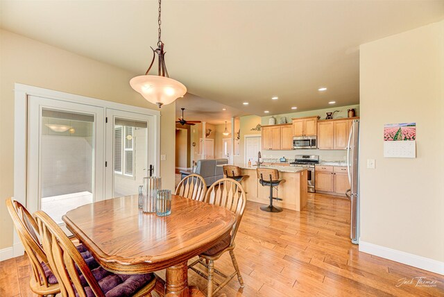 7175 Bootlegger Dr, Helena, MT 59602 - dining area featuring baseboards, light wood-style flooring, recessed lighting, and french doors