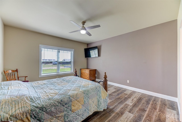 7175 Bootlegger Dr, Helena, MT 59602 - bedroom featuring wood finished floors, baseboards, and ceiling fan