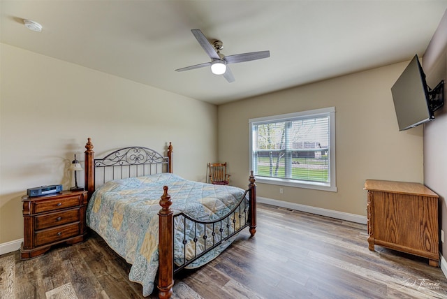 7175 Bootlegger Dr, Helena, MT 59602 - bedroom with wood finished floors, baseboards, and a ceiling fan