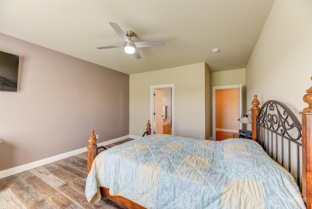 7175 Bootlegger Dr, Helena, MT 59602 - bedroom with wood finished floors, baseboards, ceiling fan, and connected bathroom